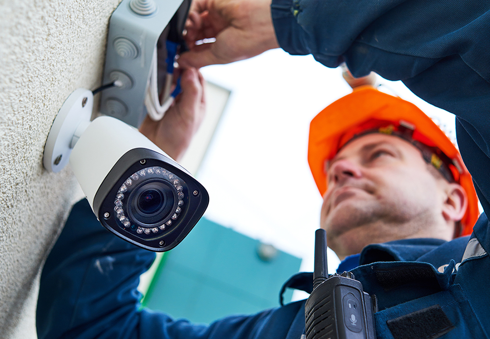 Technician Installing Security Camera