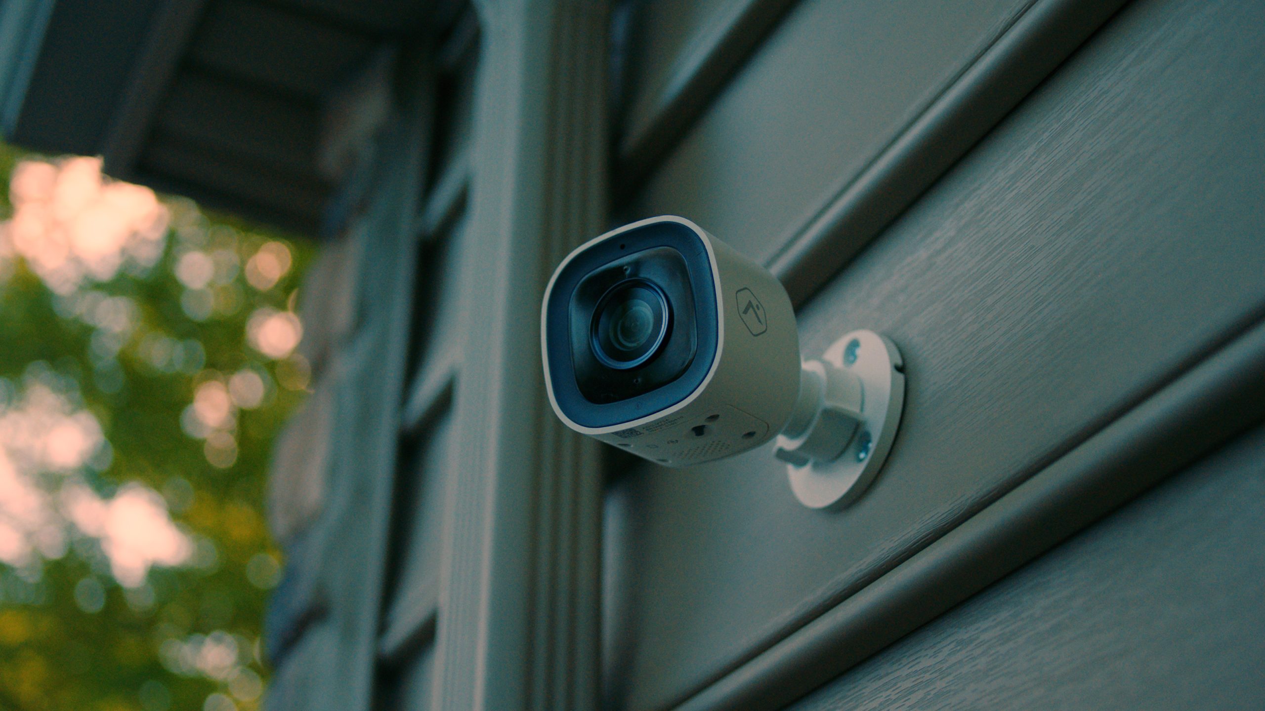A camera is secured above a garage door.